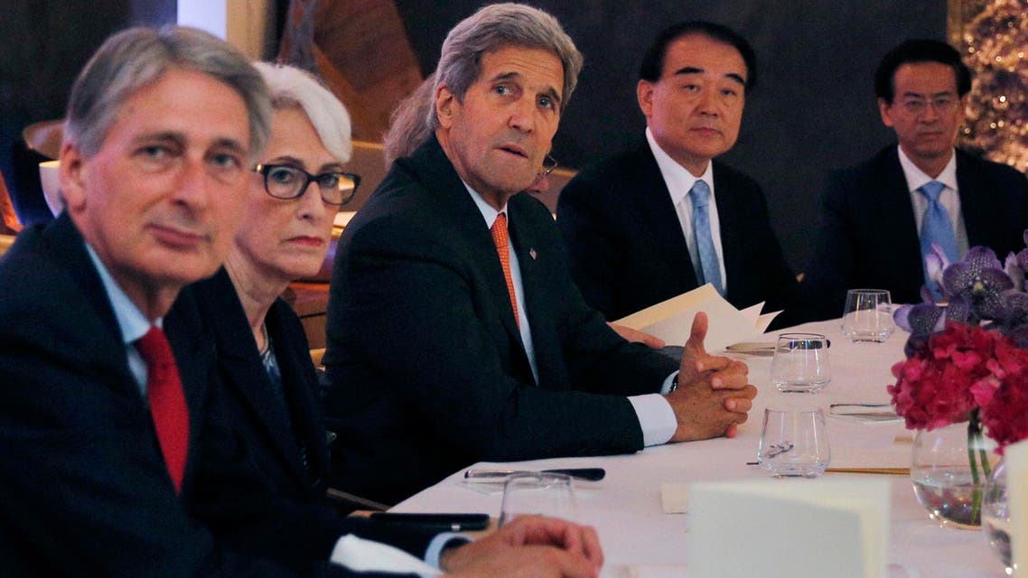 British Foreign Secretary Philip Hammond, left, U.S. Under Secretary for Political Affairs Wendy Sherman, 2nd left, U.S. Secretary of State John Kerry. centre, and China‘s deputy foreign minister Li Baodong, 2nd right. AP