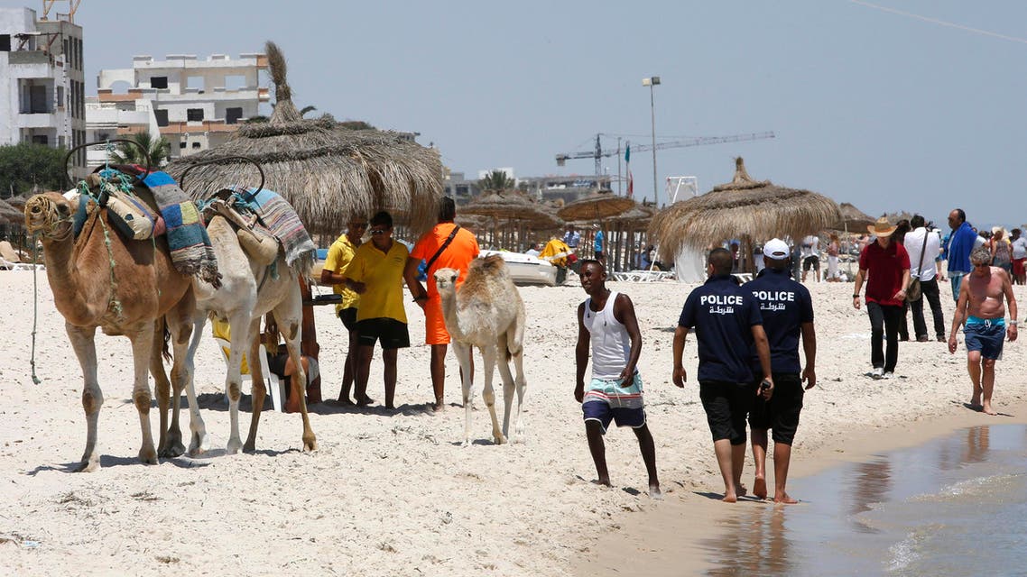 Police officers patrol on the beach of Sousse, Tunisia, Sunday, June 28, 2015. AP