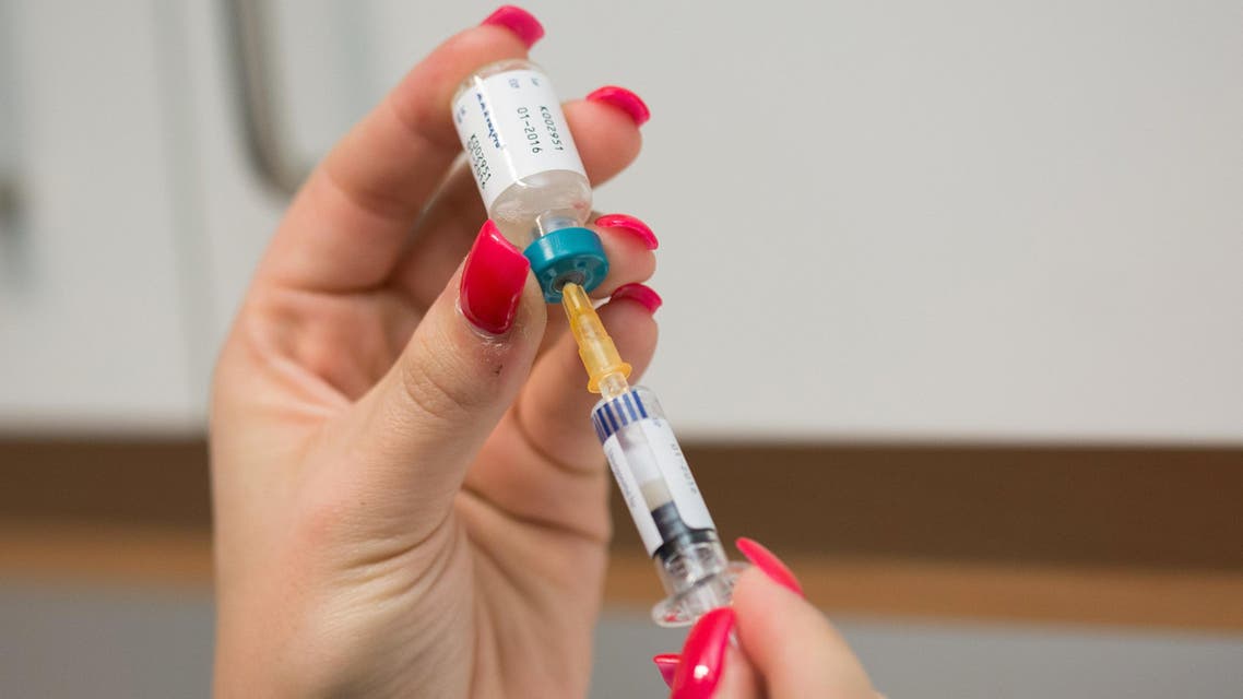 A doctor's assistant prepares a measles vaccination in Berlin, Germany, Tuesday, Feb. 24, 2015. An 18-month-old boy has died of measles amid an outbreak of the disease in Berlin, a hospital in the German capital said Tuesday. An autopsy on the child, who wasn't inoculated against measles, showed that he had an unspecified other disease as well but that wouldn't have led to his death without the measles infection, the Charite hospital said. (AP Photo/dpa, Lukas Schulze)