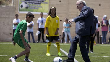 In this Wednesday, May 20, 2015 file photo, FIFA President Sepp Blatter kicks a ball during the inauguration of a football stadium in the village Dura Al-Qari' near the West Bank city of Ramallah. An aborted bid by the Palestinians to expel Israel from FIFA, the world soccer federation, has set off an uproar in Israel, raising fears that more such diplomatic assaults are on the way. (AP Photo/Majdi Mohammed, File)