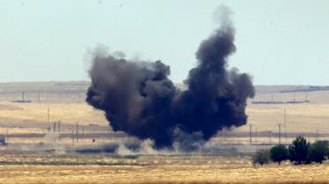 In this photo taken from the Turkish side of the border between Turkey and Syria, in Akcakale, Sanliurfa province, southeastern Turkey, smoke from a US-led airstrike rises over the outskirts of Tal Abyad, Syria, Sunday, June 14, 2015. Syrian Kurdish fighters closed in on the outskirts of a strategic Islamic State-held town on the Turkish border Sunday, Kurdish officials and an activist group said, potentially cutting off a key supply line for the extremists' nearby de facto capital. Taking Tal Abyad, some 80 kilometers (50 miles) from the Islamic State stronghold of Raqqa, would mean the group wouldn't have a direct route to bring in new foreign militants or supplies.(AP Photo/Lefteris Pitarakis)