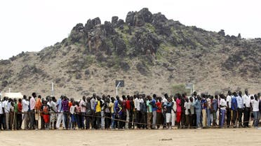 Refugees from South Sudan queue to attend the celebrations to mark World Refugee Day at the Kakuma refugee camp in Turkana District, northwest of Kenya's capital Nairobi, June 20, 2015. June 20 is World Refugee Day, an occasion that draws attention to those who have been displaced around the globe. REUTERS/Thomas Mukoya