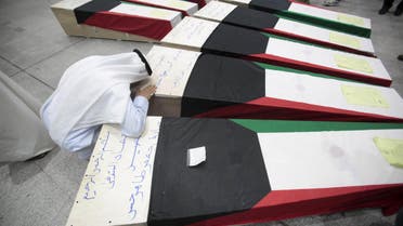 A man reacts next to coffins of victims of Friday's bombing at the Imam Sadeq mosque in Kuwait City, at the international airport in Najaf, south of Baghdad, June 27, 2015. The attack, which killed 27 and injured more than 200 at the mosque, was claimed by Islamic State's Wilayat of Najd division. Some of victims' bodies have been brought to the Shi'ite holy cities of Najaf and Karbala in Iraq for burial. The coffins are seen shrouded with Kuwaiti flags. REUTERS/Alaa Al-Marjani TPX IMAGES OF THE DAY Open in New Window Download Picture Share via EmailPrint      Date28/06/2015 00:09     Dimensions3000 x 2000     Size589KB