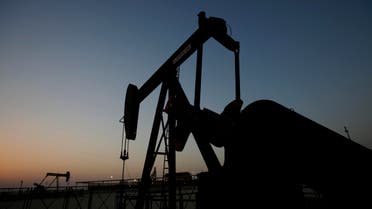Oil pumps work at sunset in the desert oil fields of Sakhir, Bahrain, Tuesday, Oct. 14, 2014. The price of oil suffered its biggest drop in nearly two years after the International Energy Agency reduced its forecast for demand for this year and next. Benchmark U.S. crude fell $3.90, or 4.5 percent, to close at $81.84 a barrel on the New York Mercantile Exchange. That was the biggest decline since November 2012. The closing price is the lowest since June 2012. (AP Photo/Hasan Jamali)
