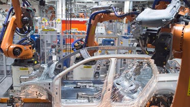 Robots weld a Passat Variant body during a press tour at the plant of the German car manufacturer Volkswagen Sachsen in Zwickau, Germany, Monday, Jan. 26, 2015. More than 4.7 Million vehicles (Golf and Passat) have left the production facilities since foundation of the Zwickau plant in 1990. (AP Photo/Jens Meyer)
