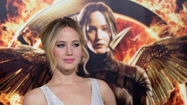 Cast member Jennifer Lawrence poses at the premiere of "The Hunger Games: Mockingjay - Part 1" in Los Angeles, California, in this file photo taken November 17, 2014. With hundreds of costumes, props, photos and interactive displays, "The Hunger Games: The Exhibition" which opened on Wednesday at Discovery Times Square, brings fans into the dystopian, post-apocalyptic nation of Panem that was created in the films. REUTERS/Mario Anzuoni/Files