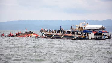 The Philippine Coast Guard rescues boat passengers after a ferry boat capsized in choppy waters, on Thursday, July 2, 2015, in Ornoc, Philippines.
