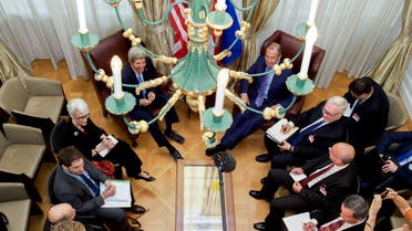 US Secretary of State John Kerry - seen through a chandelier - and his advisers sit with Russian Foreign Minister Sergey Lavrov and their counterparts on June 30, 2015, in Vienna, Austria. (File: AFP)