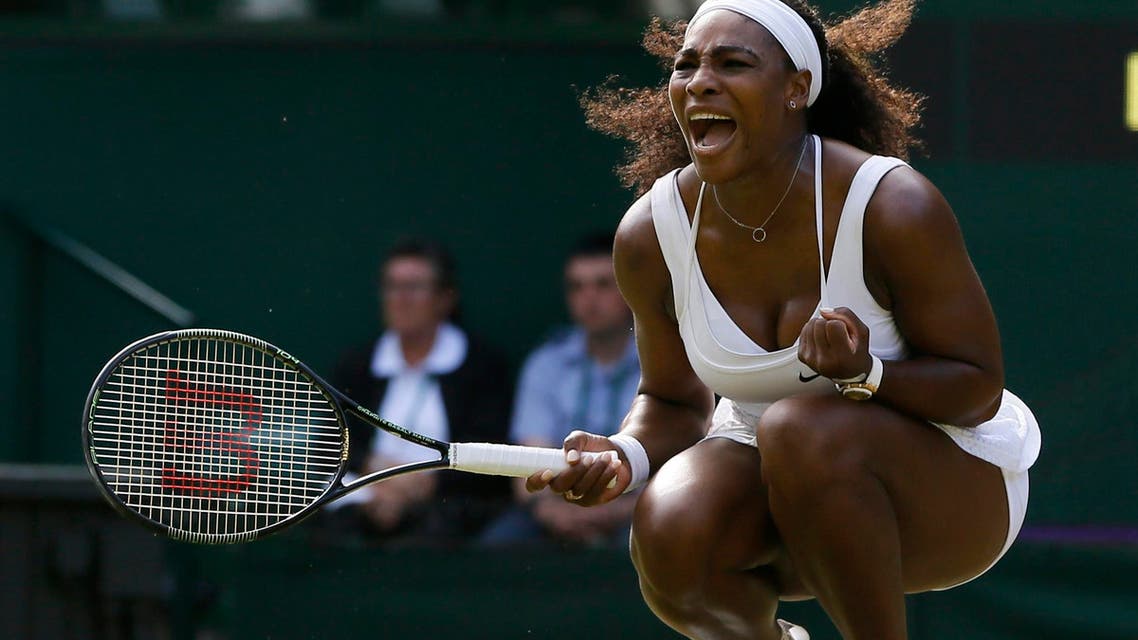 Serena Williams of the United States celebrates winning a point against Heather Watson of Britain, during their singles match at the All England Lawn Tennis Championships in Wimbledon, London, Friday July 3, 2015. (AP Photo/Kirsty Wigglesworth)