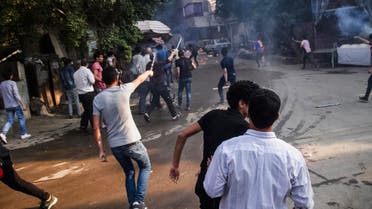 Supporters of the Muslim Brotherhood aim their fireworks toward Egyptian security forces following their protest against the government, while marching on a street in Cairo's Matariya district, Egypt, Tuesday, June 30, 2015. AP