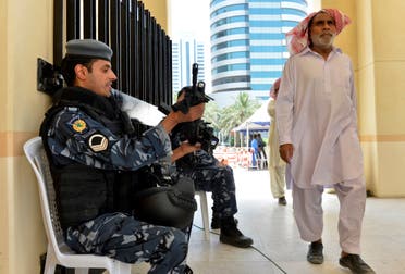 Kuwaiti police are on hand as worshippers arrive for joint Sunni-Shiite Friday prayers at the Grand Mosque in Kuwait City on Friday, July 3, 2015, one week after a suicide attack by an Islamic State sympathizer on Shiite worshippers. Instead of fueling the kind of sectarian animosity that has devastated Iraq and Syria, the Kuwait attack has reawakened a sense of national solidarity not seen since Saddam Hussein's 1990 invasion. (AP Photo)
