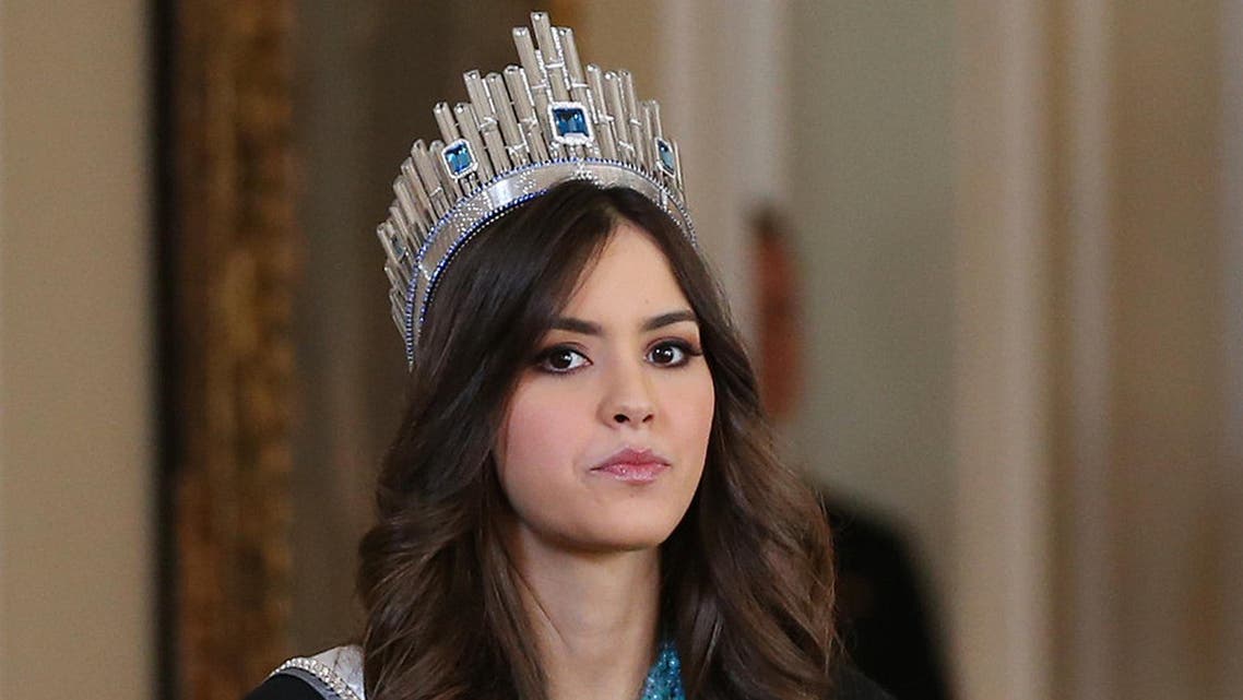 Miss Universe Paulina Vega, from Colombia, takes part in a welcoming ceremony at the Presidential Palace in Bogota, Colombia, Tuesday, April 28, 2015. Vega is in her native country for her first official visit since she was crowned Miss Universe in January. (AP Photo/Fernando Vergara)