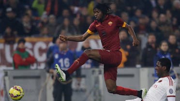Roma's Gervinho, left, and AC Milan's Cristian Zapata fight for the ball during their Serie A soccer match between Roma and AC Milan at Rome's Olympic stadium, Saturday, Dec. 20, 2014. (AP)