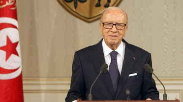 A handout picture released by the Tunisian Presidency Press Service shows Tunisian President Beji Caid Essebsi (R) speaking during a press conference in Tunis on July 4, 2015. (AFP)
