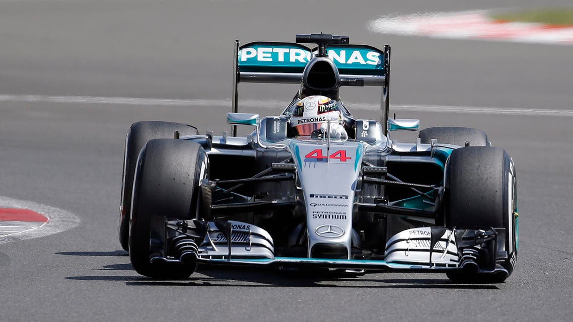 British Mercedes driver Lewis Hamilton steers his car during the qualyfying for the British Formula One Grand Prix at Silverstone circuit, Silverstone, England, Saturday, July 4, 2015. AP