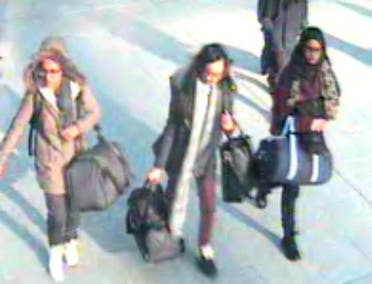 A CCTV image received by London's Metropolitan Police (MPS) on February 23, 2015 shows (L-R) British teenagers Amira Abase, Kadiza Sultana and Shamima Begum (Still courtesy of Metropolitan Police)