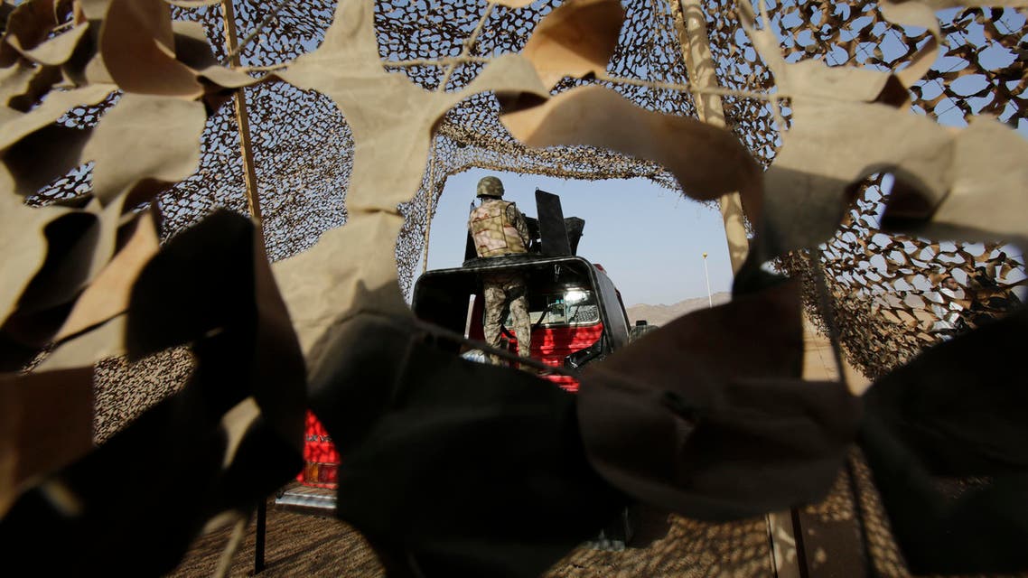 In this Tuesday, April 21, 2015 file photo, a Saudi soldier stands alert, on the Saudi-Yemen border in Najran, Saudi Arabia. (AP)