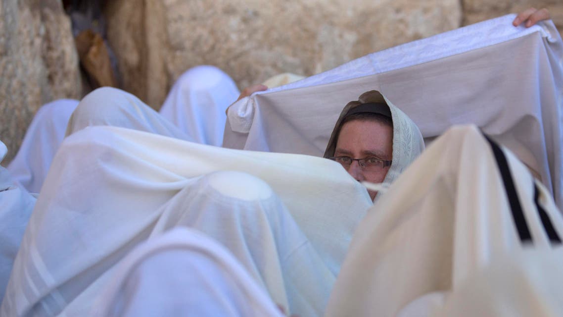 Covered in prayer shawls, Israeli ultra-orthodox Jewish men of the Cohanim Priestly caste participate in a blessing during the Jewish holiday of Passover. (File: AP)