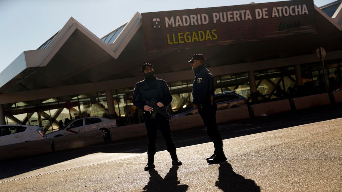 Armed police officers stand guard outside Atocha train station in Madrid, Spain. (File: AP)