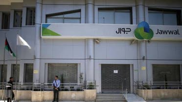 Palestinian policemen loyal to Hamas stand guard outside the closed Jawwal company headquarters in Gaza City June 30, 2015. The Hamas-appointed attorney general in the Gaza Strip shut down the offices of the territory's only mobile-phone provider on Tuesday, saying the company, Jawwal, had not paid its taxes. Jawwal is a subsidiary of the Palestine Telecommunications Co. (PalTel), the largest listed company in the Palestinian territories. It is the sole provider of mobile phone services in Gaza, with around 1.3 million clients. Executives at PalTel rejected the attorney general's accusations, saying all relevant taxes had been paid to the Palestinian Authority in the Israeli-occupied West Bank, where the company is registered and based. To match PALESTINIANS GAZA/CELLULAR REUTERS/Mohammed Salem