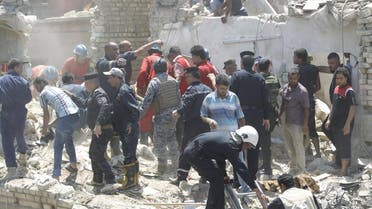 Iraqi security forces and people stand outside damaged houses after an Iraqi plane accidentally dropped a bomb in Ni'iriya district in Baghdad July 6, 2015. The Iraqi plane accidentally dropped the bomb on an eastern Baghdad neighbourhood on Monday, police and residents said, killing at least five people and destroying several houses. The Sukhoi jet had been taking part in an air strike against Islamic State militants, Iraqi television said. One of its bombs failed to detach from the plane during the mission then fell as the plane was returning to base. REUTERS/Ahmed Saad