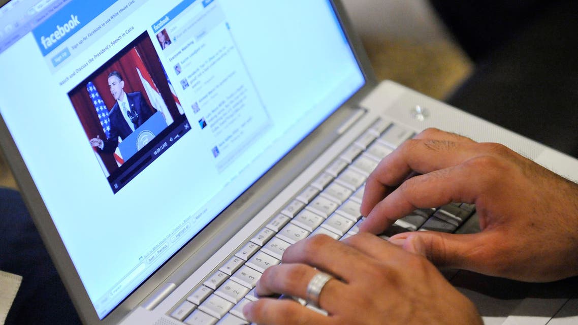 Muslim American Zabie Mansoory, 23, monitors a Facebook discussion board while watching President Barack Obama's televised coverage of President Barack Obama's speech from Cairo University, in the Sylmar area of Los Angeles, early Thursday June 4, 2009. (AP Photo/Gus Ruelas)