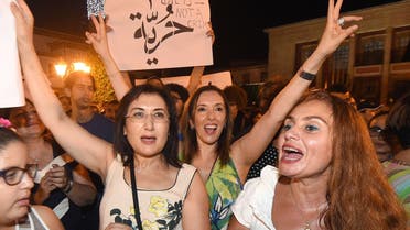 Moroccans shout slogans and hold placards during a demonstration in Rabat on July 6, 2015. The protesters demonstrated for freedom and against the arrest of two Moroccan women after their outfits were deemed inappropriate. (AFP)