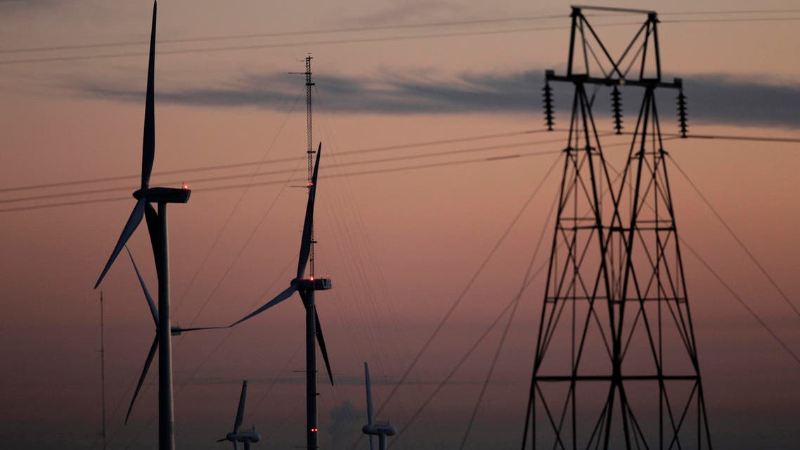 This Nov. 3, 2012 file photo shows wind turbines, alongside an electrical tower, at the National Wind Technology Center, run by the U.S. Department of Energy, outside Boulder, Colo. Reuters