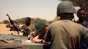 In this photo taken June 23, 2015, French forces disarm a man during a patrol in the desert of Northern Mali along the border with Niger on the outskirts of Asongo, Northern Mali. French forces help to disarm groups in northern Mali after a peace deal reached. (AP Photo/Maeva Bambuck)