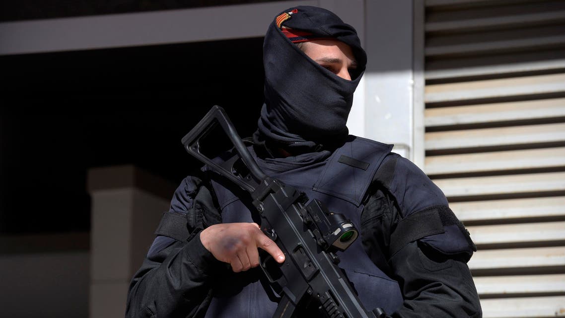 A Mossos d'Esquadra regional police officer stands guard during a raid in one of the region's biggest operations against jihadi activity in Sabadell, near Barcelona, Spain, Wednesday, April 8, 2015. AP
