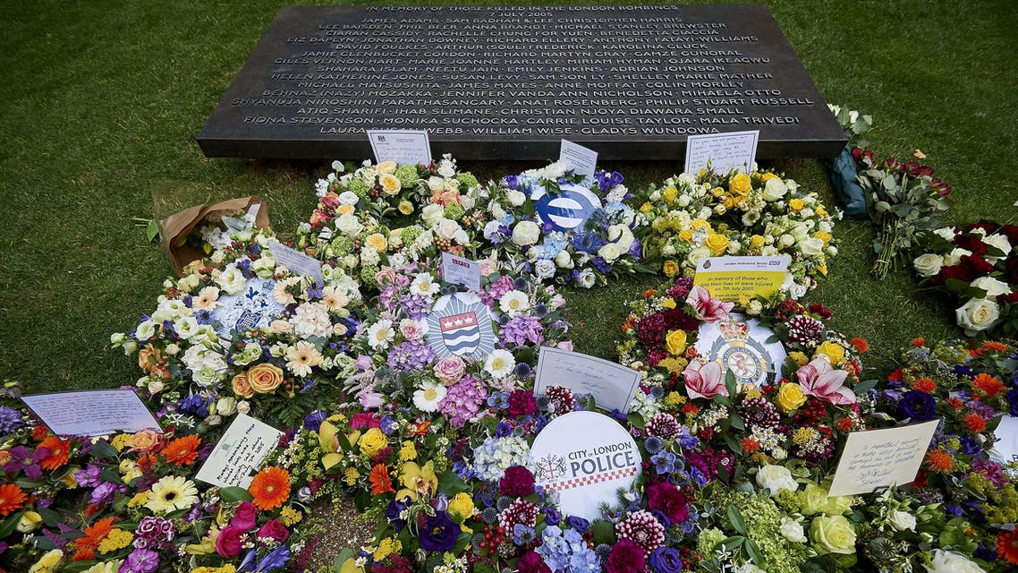Floral tributes and messages are pictured following a wreath laying ceremony in London's Hyde Park on July 7, 2015, in memory of the 52 victims of the 7/7 London attacks. (AFP)