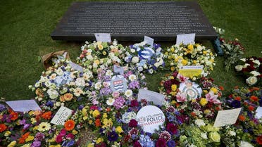  Floral tributes and messages are pictured following a wreath laying ceremony in London's Hyde Park on July 7, 2015, in memory of the 52 victims of the 7/7 London attacks. (AFP)