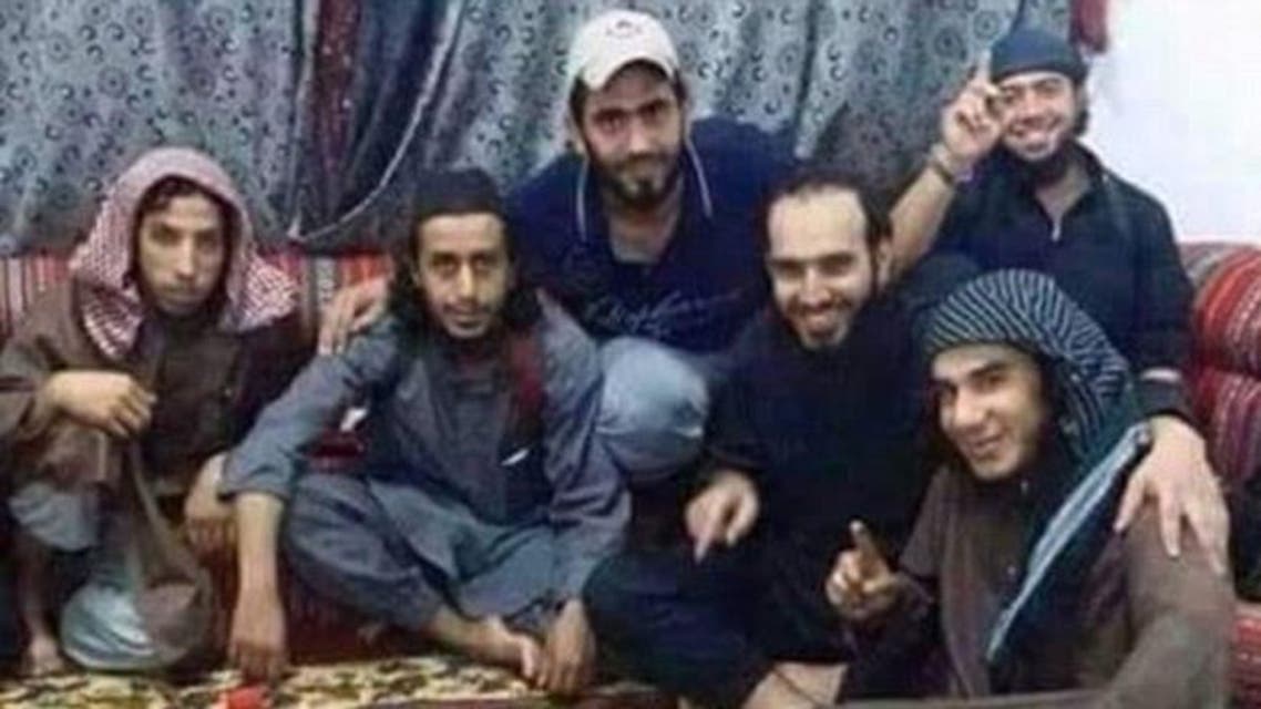 ISIS militants pose next to an iftar meal (Twitter)