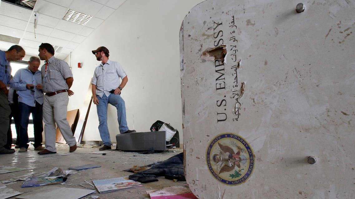 A U.S. embassy emblem is seen on a broken door during a visit for the press in the vandalized U.S. Embassy in Tripoli, Libya, Monday, Sept. 12, 2011. (File Photo: AP)