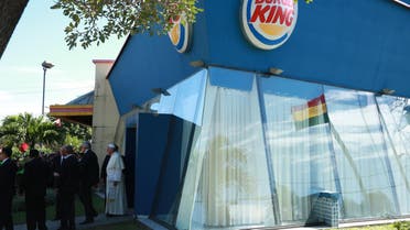Pope Francis stands in front of a Burger King restaurant at the Christ the Redeemer square in Santa Cruz, Bolivia, Thursday, July 9, 2015. (AP)