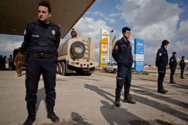 Turkish police officers stands guard outside a staging area on the outskirts of Suruc, near the Turkey-Syria border. (File: AP)