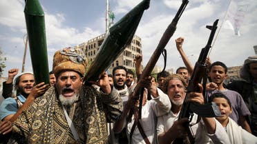 Houthi followers hold mock missiles and their rifles as they shout slogans during a demonstration against the United Nations in Sanaa. (File: Reuters)
