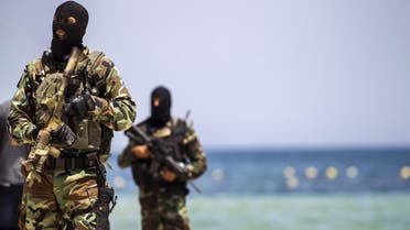 Tunisia's special forces secure the beachside of the Imperial Marhaba resort, while British, French, German and Tunisia's interior minister arrive to pay their tribute in front of a makeshift memorial in Sousse, Tunisia, June 29, 2015. R 