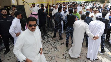 Security forces, officials and civilians gather after a deadly blast claimed by the Islamic State group that struck worshippers attending Friday prayers at a Shiite mosque in Kuwait City, Friday, June 26, 2015. Friday's explosion struck the Imam Sadiq Mosque in the neighborhood of al-Sawabir, a residential and shopping district of the capital. (AP Photo)