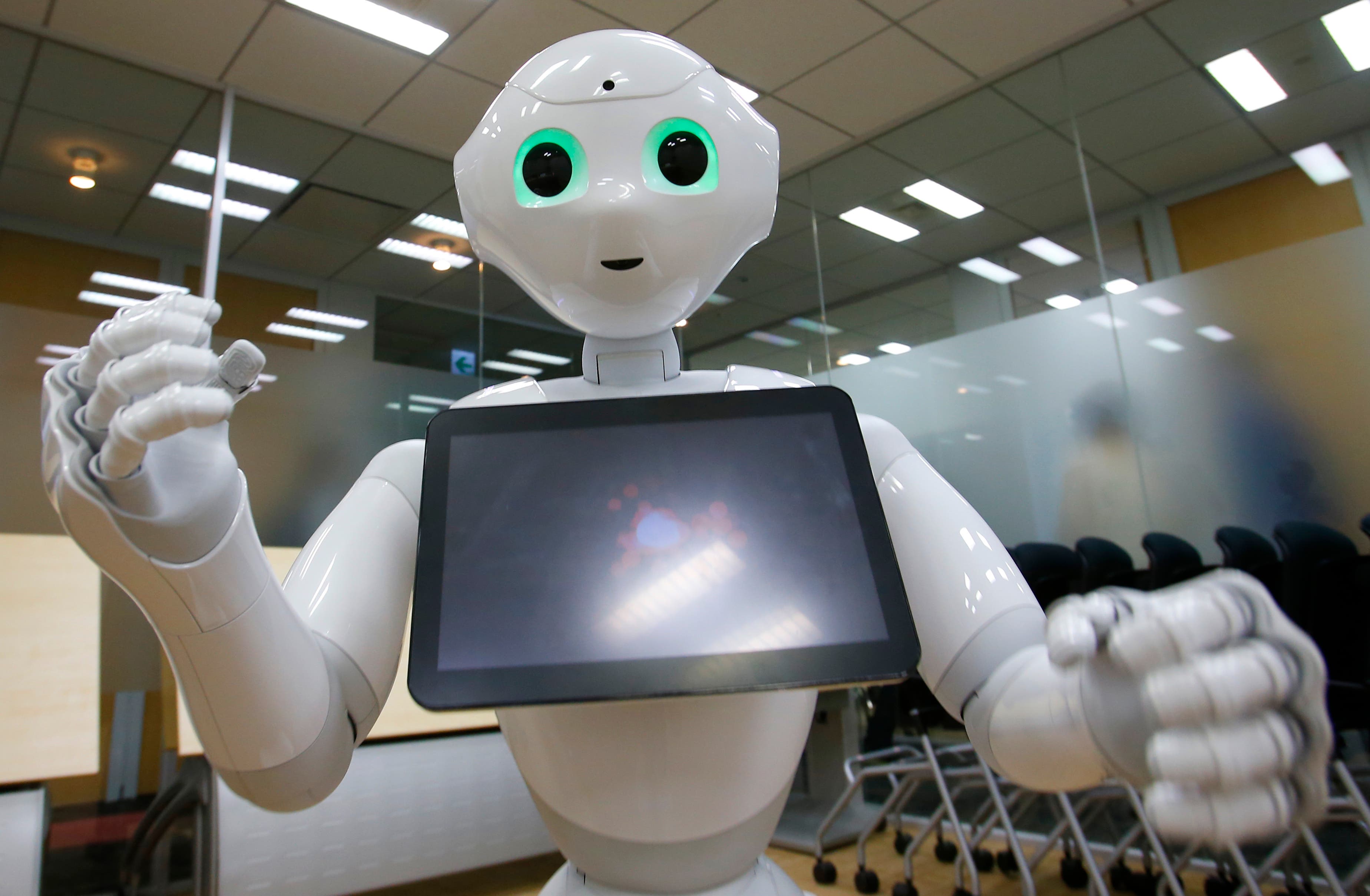 SoftBank Corp.'s new companion robot Pepper performs during an interview at the technology company's headquarters in Tokyo. (AP)
