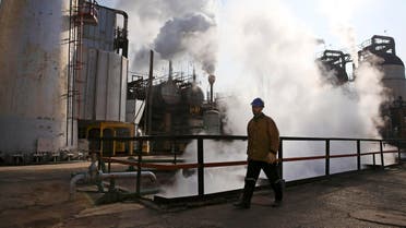 An Iranian oil worker walks at Tehran's oil refinery south of the capital in Iran. (File: AP)