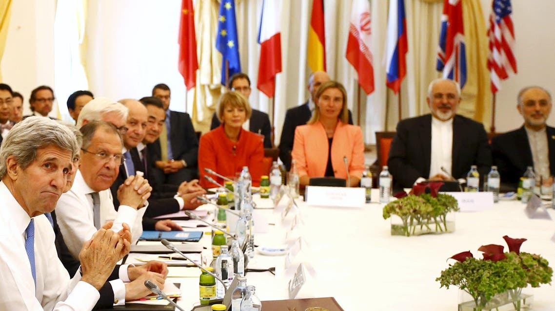 Iranian Foreign Minister Zarif sits next to European Union High Representative for Foreign Affairs Mogherini as they meet with foreign ministers from the U.S., France, Russia, Germany, China and Britain in Vienna. (Reuters)