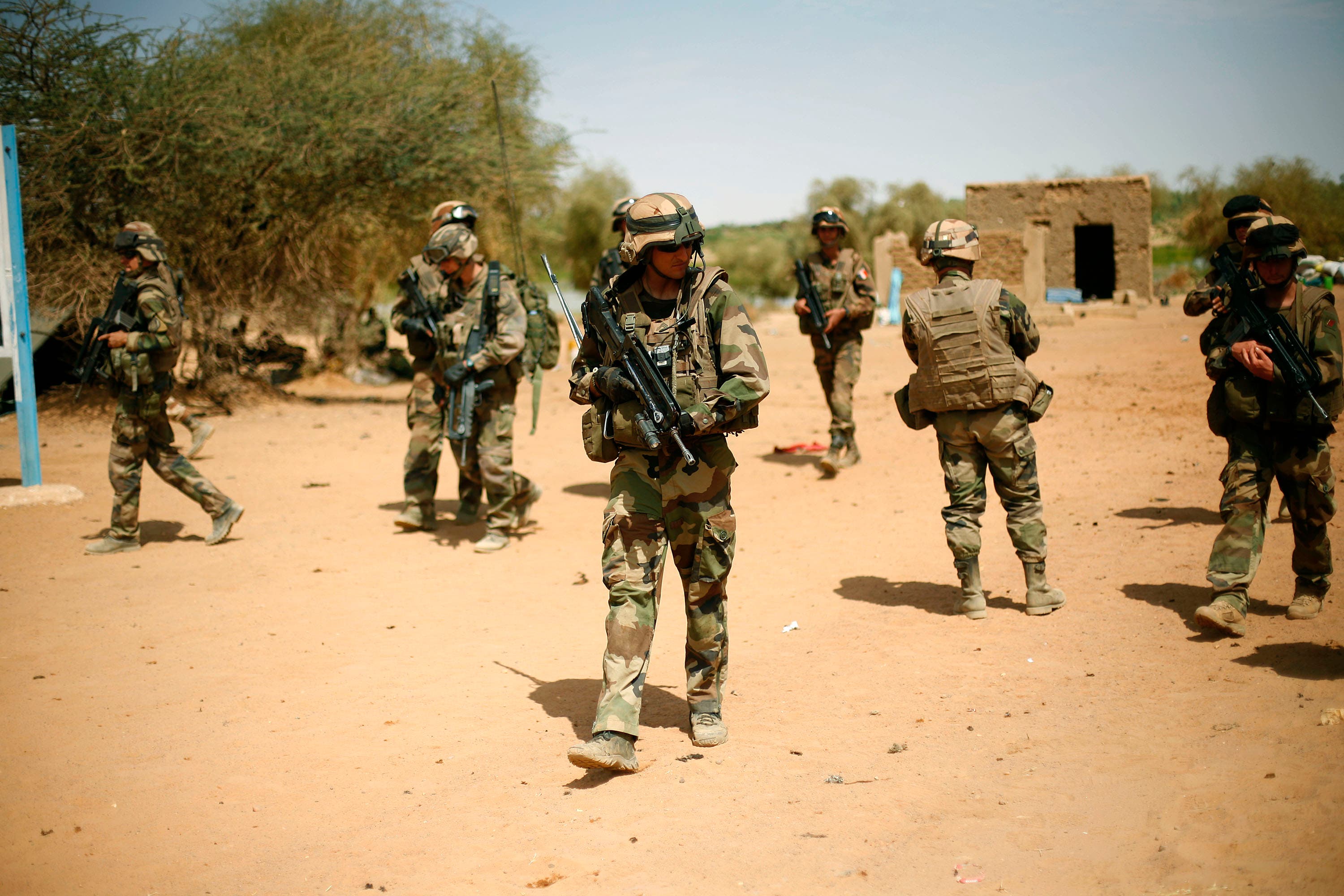 In this February 10, 2013 file photo, French soldiers secure the area where a suicide bomber attacked, at the entrance of Gao, northern Mali. (AP)