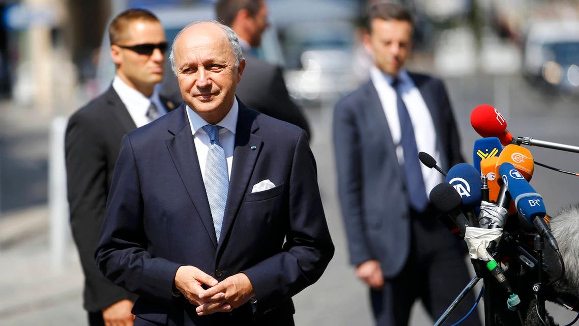 French Foreign Minister Laurent Fabius listens to journalists outside Palais Coburg, the venue for nuclear talks in Vienna, Austria, July 7, 2015. (Reuters)
