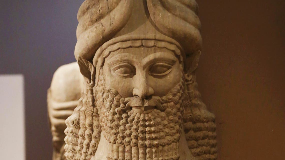 An Assyrian artifact of the head of a winged bull made out of limestone is displayed at the Iraqi National Museum in Baghdad, Iraq, Wednesday, July 8, 2015.