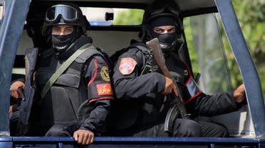 Egyptian special forces secure a convoy carrying Egypt's Prosecutor General Hisham Barakat before his funeral in Cairo, Egypt, Tuesday, June 30, 2015. AP
