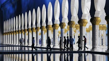 Muslims leave the Sheikh Zayed Grand Mosque after praying Taraweeh, the night prayer practiced during the month of Ramadan in Abu Dhabi AP