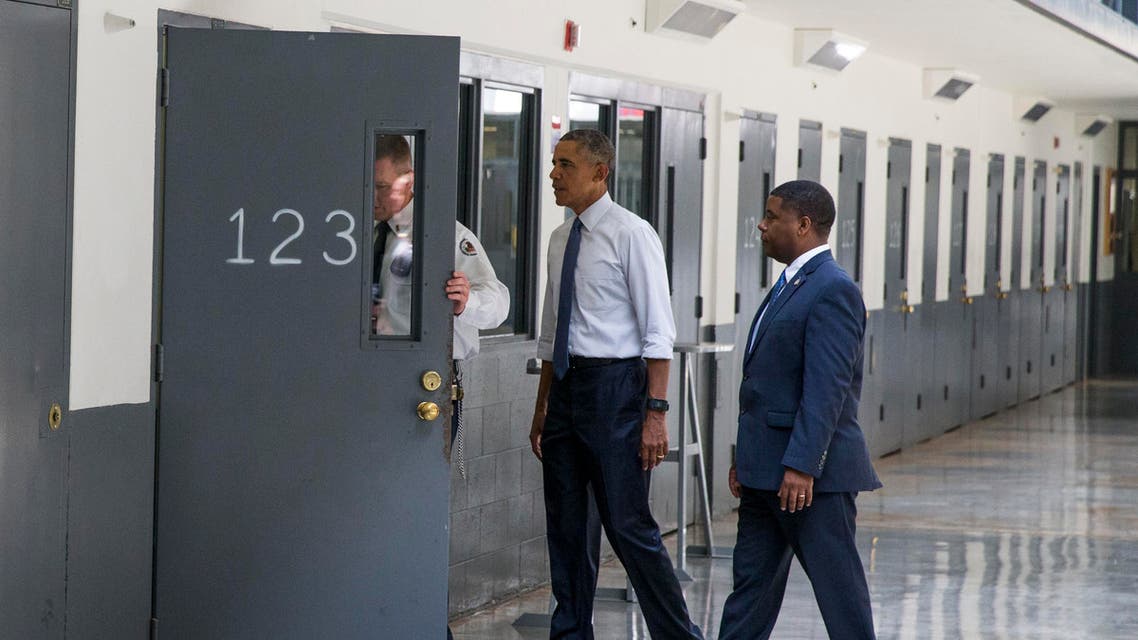 President Barack Obama is led on a tour by Bureau of Prisons Director Charles Samuels, right, and correctional officer Ronald Warlick during a visit to the El Reno Federal Correctional Institution in El Reno, Okla., Thursday, July 16, 2015. AP