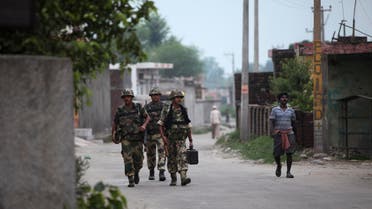 Indian Border Security Force (BSF) soldiers patrol at Garkhal village, 30 kilometers (19 miles) from Jammu, India, Wednesday, July 15, 2015. AP