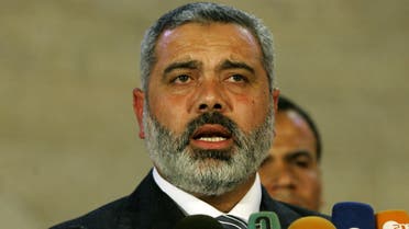 Newly installed Palestinian Prime Minister Ismail Haniya talks to the press after a swearing in ceremony at the offices of Palestinian leader Mahmud Abbas in Gaza City, Wednesday, March 29, 2006. Hamas formally took power Wednesday, with the Palestinian president swearing in its 24-member Cabinet, including 14 ministers who served time in Israeli prisons.(AP Photo/Anja Niedringhaus)